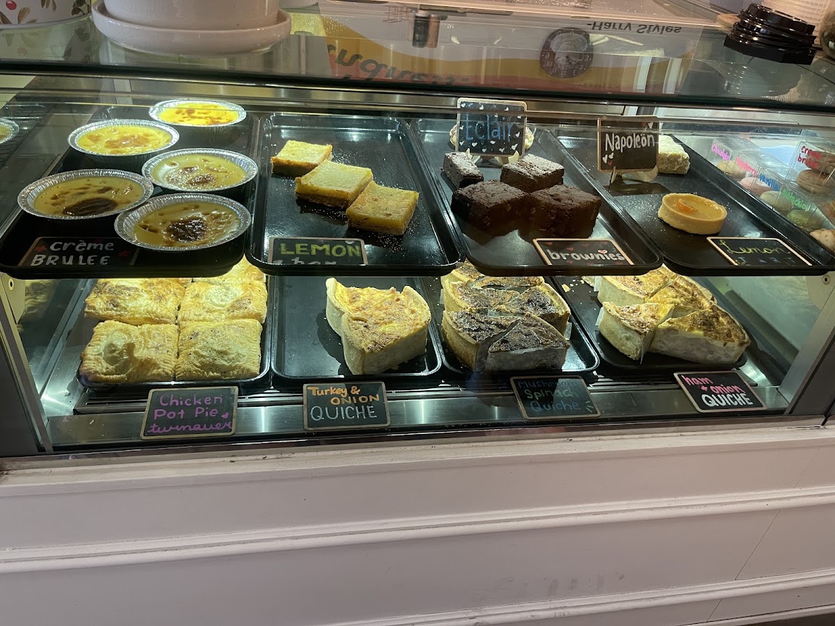 The savoury case with quiche, crème brûlée, lemon bars, éclairs and Napoléon slices